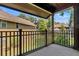 Private balcony overlooking a lush green courtyard at 5565 Colonial Chatsworth Cir, North Charleston, SC 29418