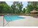 Community pool with plenty of seating at 5565 Colonial Chatsworth Cir, North Charleston, SC 29418