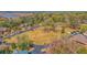 Aerial view of a waterfront community with houses and a large empty lot at 5565 Colonial Chatsworth Cir, North Charleston, SC 29418