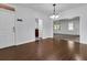 Dining room with hardwood floors and access to kitchen at 5565 Colonial Chatsworth Cir, North Charleston, SC 29418