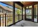 Screened porch with view of neighboring buildings and yard at 5565 Colonial Chatsworth Cir, North Charleston, SC 29418