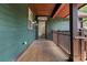 Private balcony with wood flooring and exterior access at 5565 Colonial Chatsworth Cir, North Charleston, SC 29418