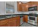 Modern kitchen with stainless steel appliances and granite counters at 5565 Colonial Chatsworth Cir, North Charleston, SC 29418