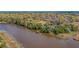Aerial view showcasing a waterfront property and pier at 5565 Colonial Chatsworth Cir, North Charleston, SC 29418
