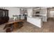 Eat-in kitchen with island, granite countertops, stainless steel appliances, and hardwood floors at 423 Cedarview Rd, Summerville, SC 29486