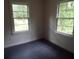 Empty bedroom with two windows, carpeted floor and white walls at 31 Hannibal Dr, Ridgeville, SC 29472