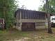Elevated home with screened porch and detached shed at 31 Hannibal Dr, Ridgeville, SC 29472