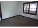 Empty bedroom with dark brown baseboards and carpeted floor at 31 Hannibal Dr, Ridgeville, SC 29472
