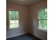 Quiet bedroom with two windows and a view of the woods at 31 Hannibal Dr, Ridgeville, SC 29472