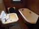 Bathroom with a clawfoot tub, pedestal sink, and toilet at 31 Hannibal Dr, Ridgeville, SC 29472