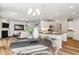 Bright dining area with a round table, rustic chairs, and hardwood floors at 4045 Rowley Lane, Summerville, SC 29486