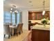 Bright dining area with a spacious table, six chairs, and large windows at 5 Middle Atlantic Wharf # 3A, Charleston, SC 29401