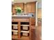 Kitchen island with added storage and wicker baskets at 5 Middle Atlantic Wharf # 3A, Charleston, SC 29401