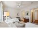 Well-lit bedroom with two twin beds and an ensuite bathroom at 5 Middle Atlantic Wharf # 3A, Charleston, SC 29401