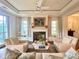 Comfortable living room with hardwood floors, fireplace, and built-in seating at 5 Middle Atlantic Wharf # 3A, Charleston, SC 29401