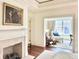 Bedroom with fireplace and access to sitting room at 5 Middle Atlantic Wharf # 3A, Charleston, SC 29401