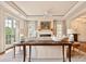 Sophisticated living room with hardwood floors and a marble fireplace as a focal point at 5 Middle Atlantic Wharf # 3A, Charleston, SC 29401