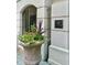 Building entrance with a stone planter and plaque at 5 Middle Atlantic Wharf # 3A, Charleston, SC 29401