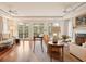 Elegant living room boasting hardwood floors, a fireplace, and French doors leading to a balcony at 5 Middle Atlantic Wharf # 3A, Charleston, SC 29401