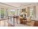 Living room with hardwood floors, a fireplace, and French doors opening to a private balcony at 5 Middle Atlantic Wharf # 3A, Charleston, SC 29401