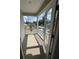 Covered porch with white railings and view of neighborhood at 108 Gray Pine Ln, Summerville, SC 29483