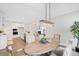 Open concept dining room with a wooden table and chairs, adjacent to the kitchen at 108 Gray Pine Ln, Summerville, SC 29483