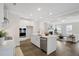 Open concept kitchen with stainless steel appliances, white cabinets, and an island at 108 Gray Pine Ln, Summerville, SC 29483