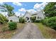 Two-story home with metal roof and long driveway at 205 Valley St, Walterboro, SC 29488
