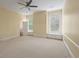 Bedroom with carpet, built-in storage, and access to bathroom at 205 Valley St, Walterboro, SC 29488