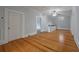 Upstairs hallway with hardwood floors, ceiling fan, and access to laundry room at 205 Valley St, Walterboro, SC 29488