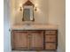 Charming bathroom with wood vanity and elegant mirror at 205 Valley St, Walterboro, SC 29488