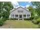 Charming two-story house with a wrap-around porch and mature landscaping at 205 Valley St, Walterboro, SC 29488