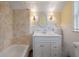 Updated bathroom features a white vanity, tile shower, and classic fixtures at 205 Valley St, Walterboro, SC 29488