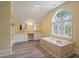Elegant bathroom with double vanity and large tub at 205 Valley St, Walterboro, SC 29488