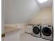 Laundry room with washer, dryer, and built-in shelving at 205 Valley St, Walterboro, SC 29488