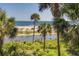 Scenic view of palm trees, ocean and tranquil waterway at 403 Pelican Flight Dr, Dewees Island, SC 29451