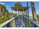Gazebo with bench overlooking the beach and ocean at 403 Pelican Flight Dr, Dewees Island, SC 29451
