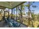 Relaxing screened porch with rocking chairs, offering stunning ocean views at 403 Pelican Flight Dr, Dewees Island, SC 29451