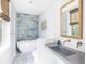 Spa-like bath with concrete sink, marble floors at 403 Pelican Flight Dr, Dewees Island, SC 29451