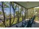 Enjoy ocean views from this screened porch, complete with rocking chairs at 403 Pelican Flight Dr, Dewees Island, SC 29451