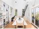 Bright dining room with large table, built-in shelves at 403 Pelican Flight Dr, Dewees Island, SC 29451