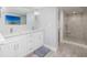 Bathroom with double vanity, shower, and modern design at 403 Pelican Flight Dr, Dewees Island, SC 29451