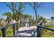 Elevated boardwalk leads to the beach with scenic waterway views at 403 Pelican Flight Dr, Dewees Island, SC 29451