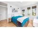 Charming bedroom with a full bed, and access to a deck at 403 Pelican Flight Dr, Dewees Island, SC 29451