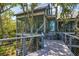 Two-story home with expansive decks and screened porch at 403 Pelican Flight Dr, Dewees Island, SC 29451