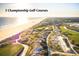 Aerial view of golf course with ocean in background at 4426 Sea Forest Dr, Kiawah Island, SC 29455