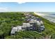 Aerial of oceanfront property, highlighting the building and surrounding area at 4426 Sea Forest Dr, Kiawah Island, SC 29455