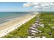 Aerial view of beachfront community with ocean and homes at 4426 Sea Forest Dr, Kiawah Island, SC 29455