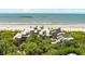 Wide aerial view of the property, showing the beach and complex buildings at 4426 Sea Forest Dr, Kiawah Island, SC 29455