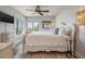 Main bedroom with a king-size bed, ocean view, and distressed-white furniture at 4426 Sea Forest Dr, Kiawah Island, SC 29455